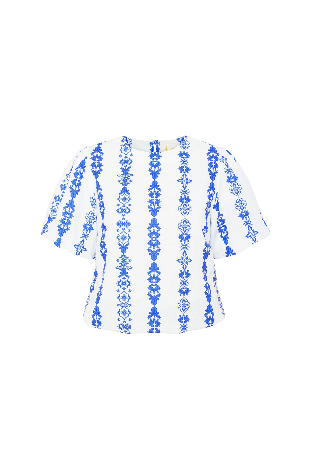 blue and white ornate blouse