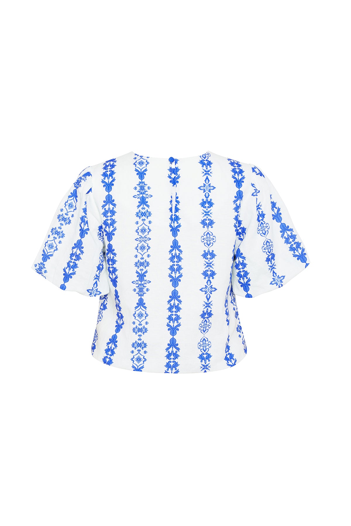 blue and white ornate blouse